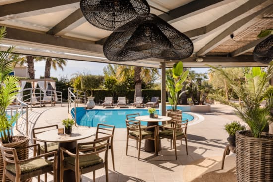 a pool with chairs around it