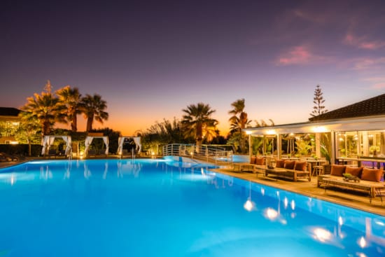 a pool with a building in the background