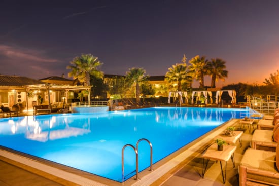 a pool with chairs around it