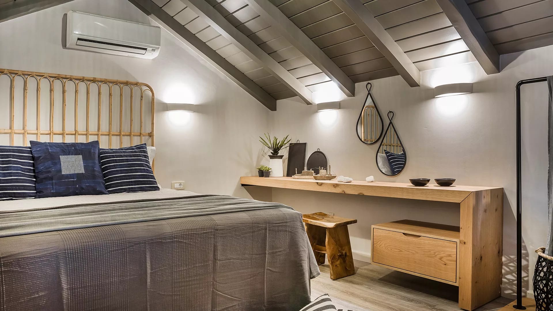 a room with a bed desk and a bed