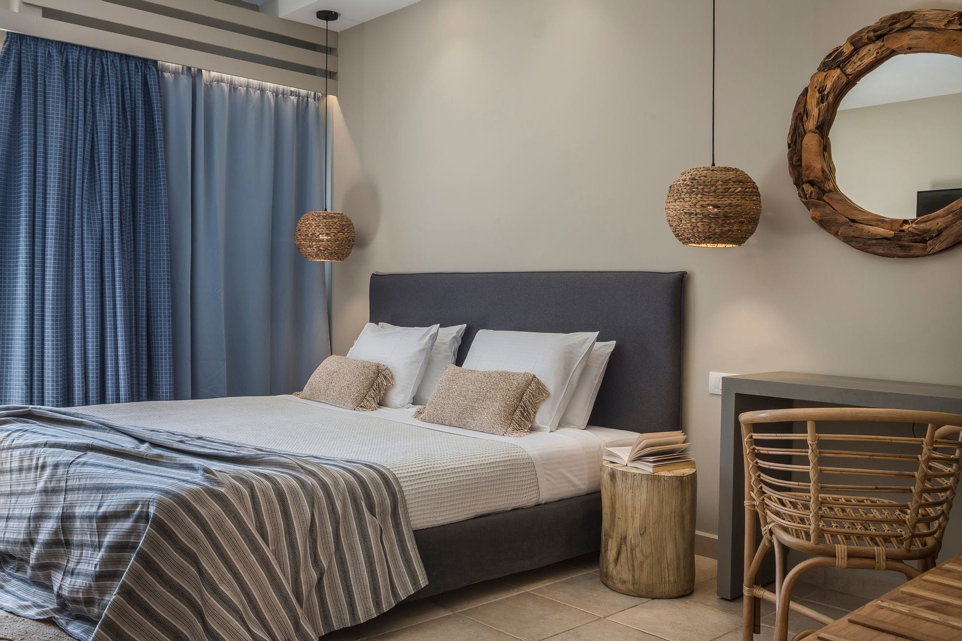 a bed with a mirror above it