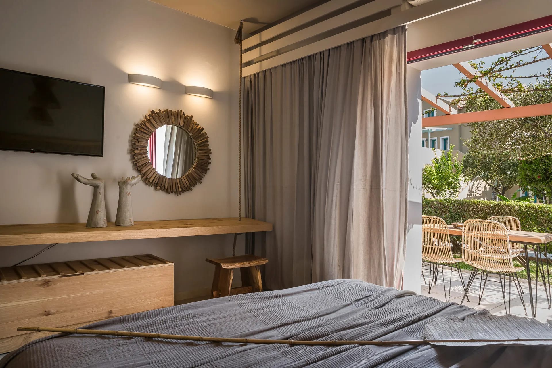 a bedroom with a bed and a mirror