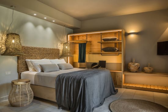 a bedroom with a bed and a shelf