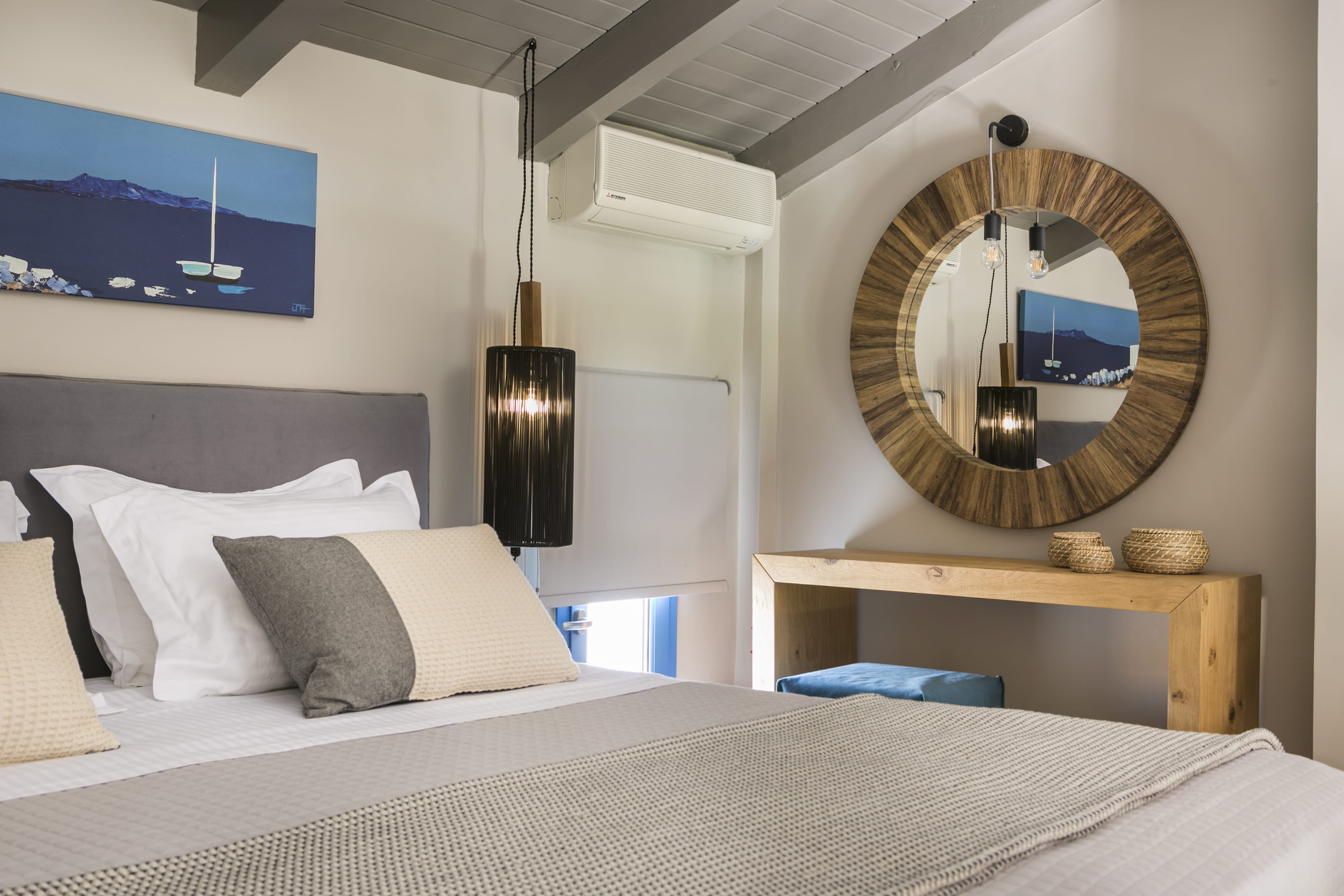 a bedroom with a large mirror