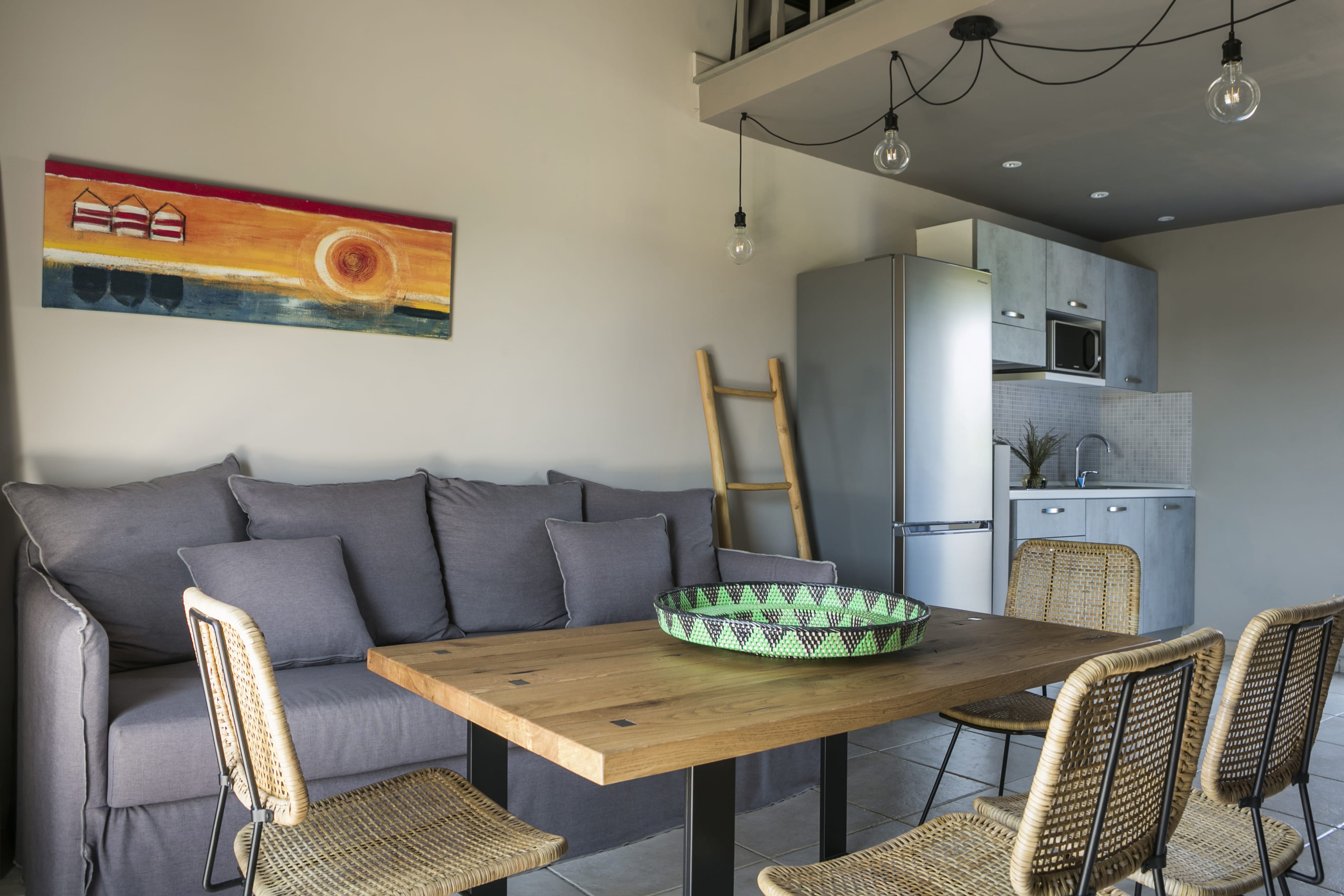 a living room with a table and chairs