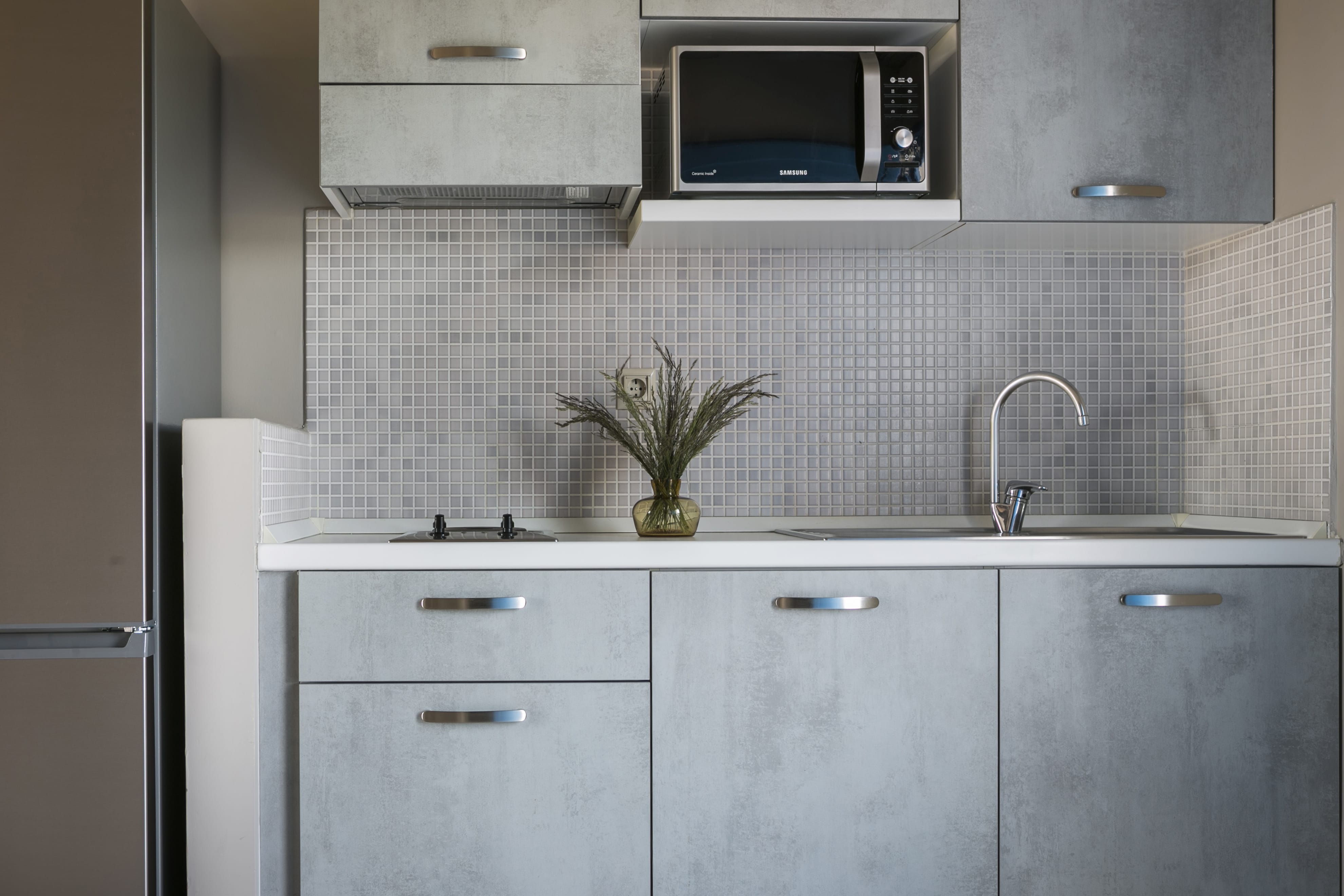a kitchen with white cabinets