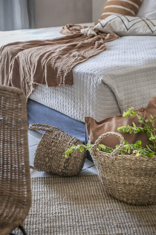 a couple of baskets on a couch