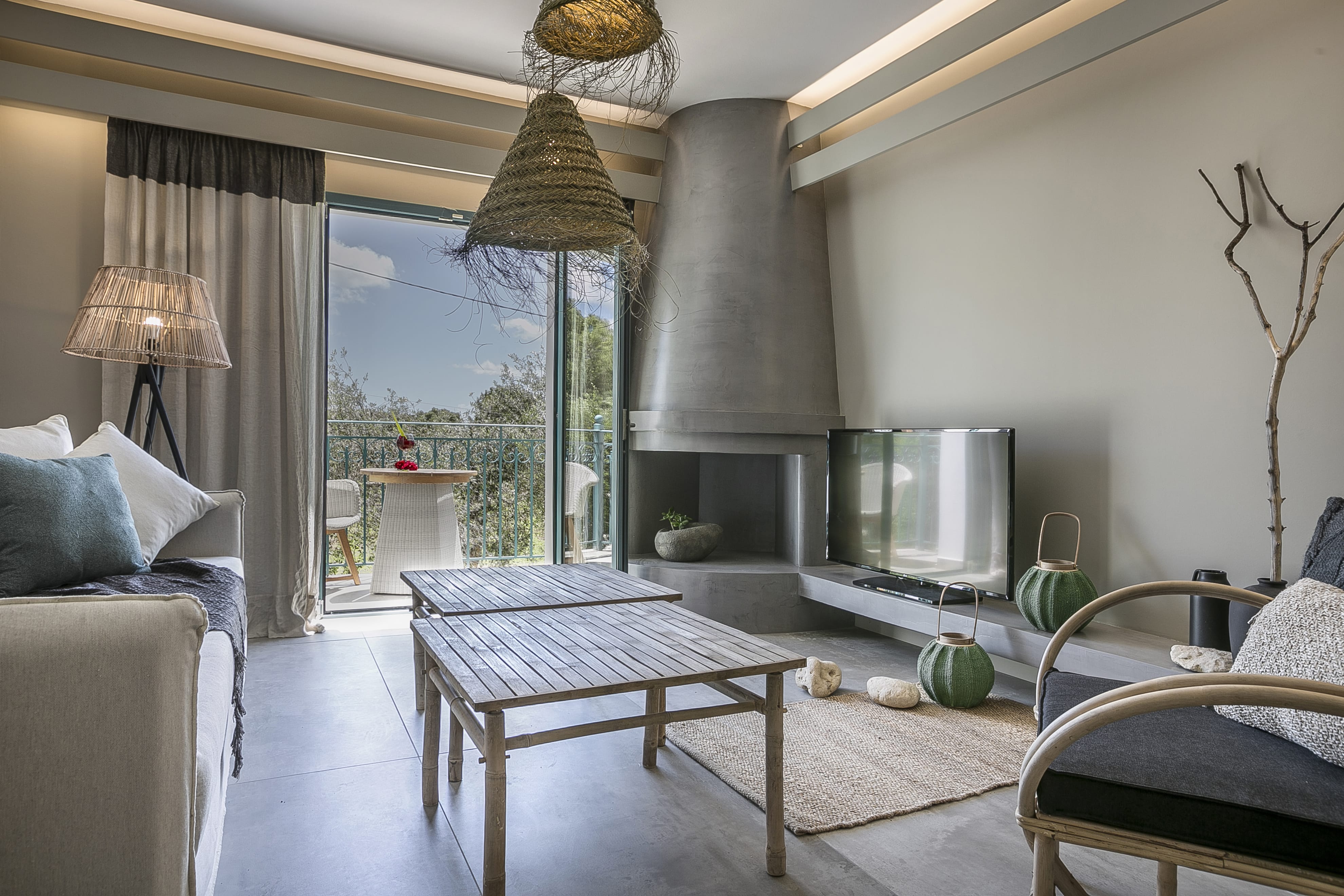 a living room with a tv and couches