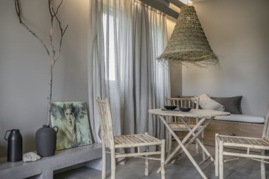 a room with a table and chairs