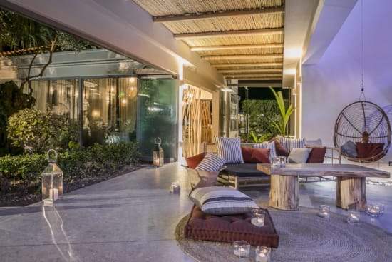 a patio with a table and chairs