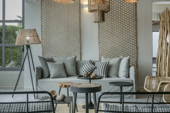 a couch with a table and chairs