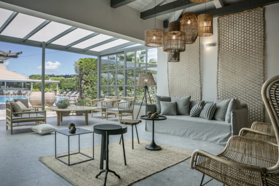 a living room with a couch and chairs