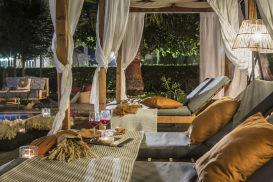 a living room with a table and chairs