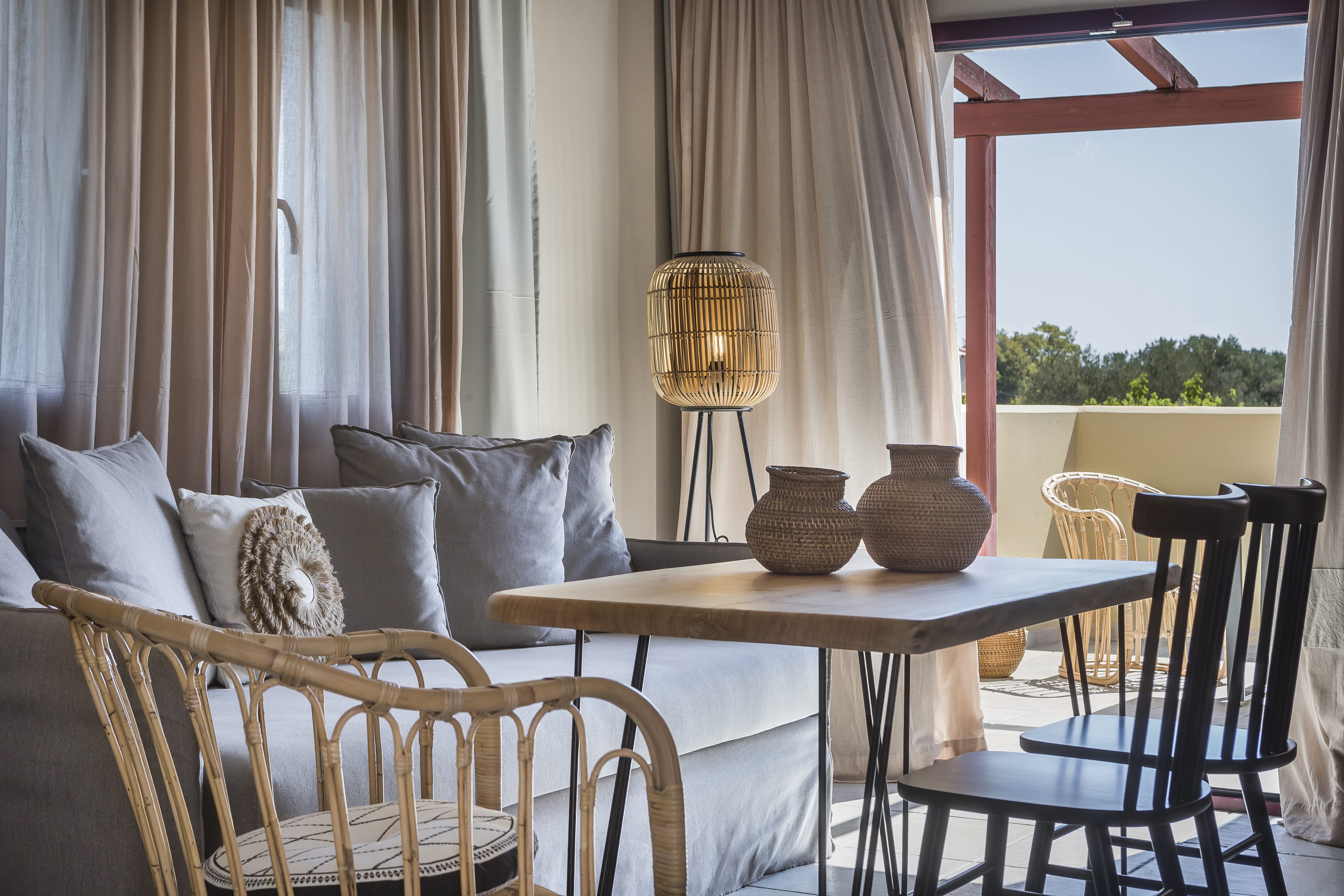 a living room with a table and chairs