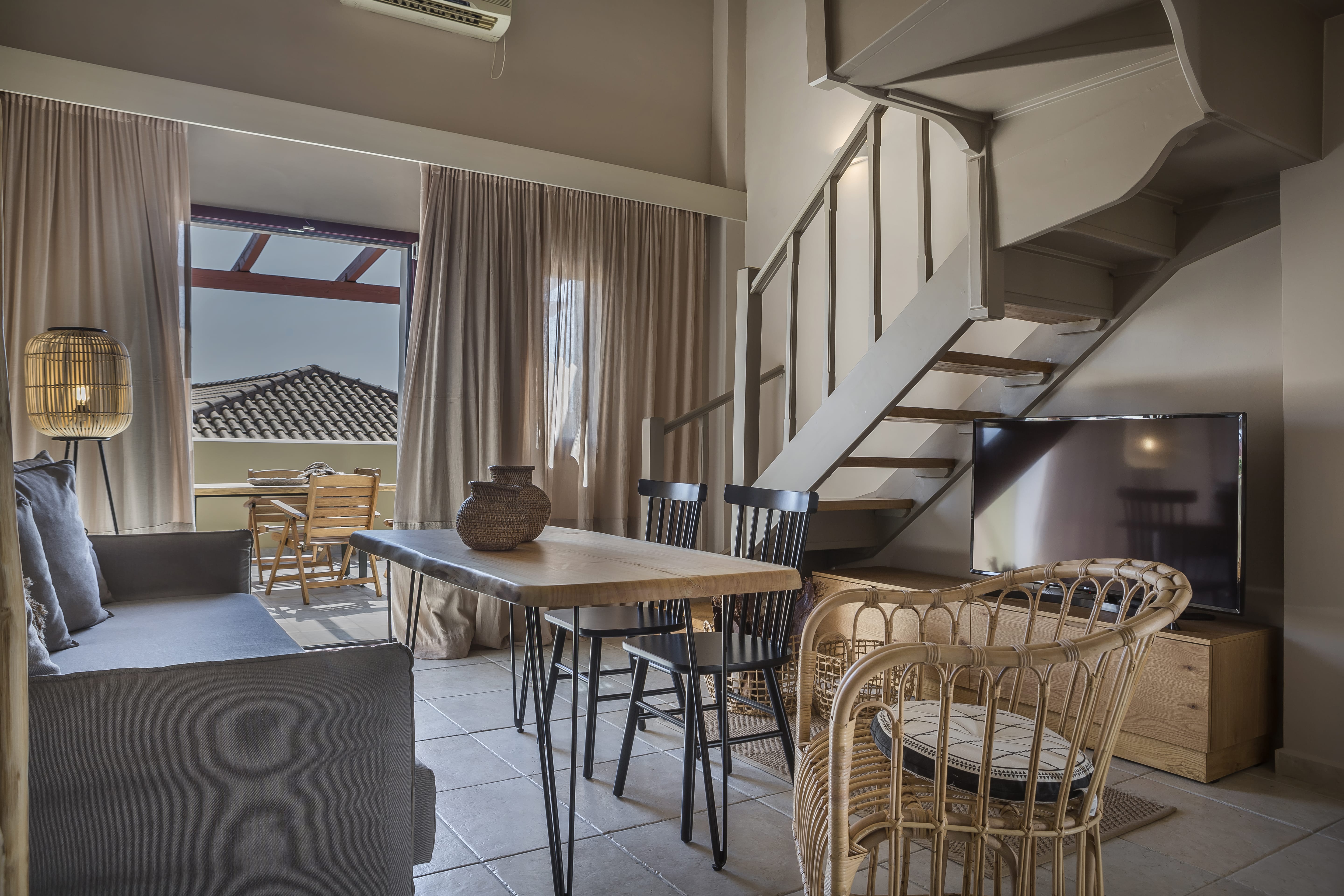 a room with a staircase and a table