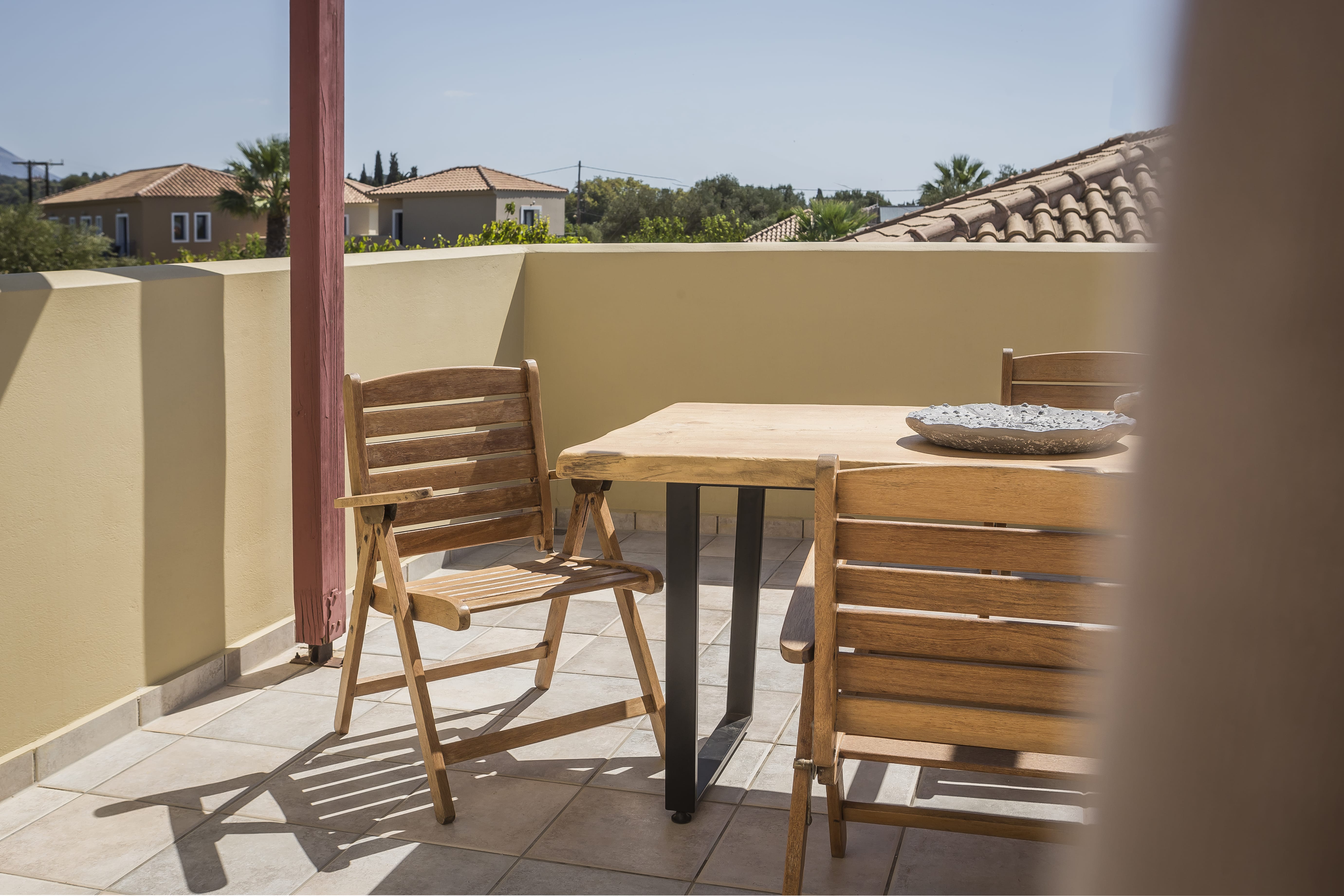 a table and chairs on a deck