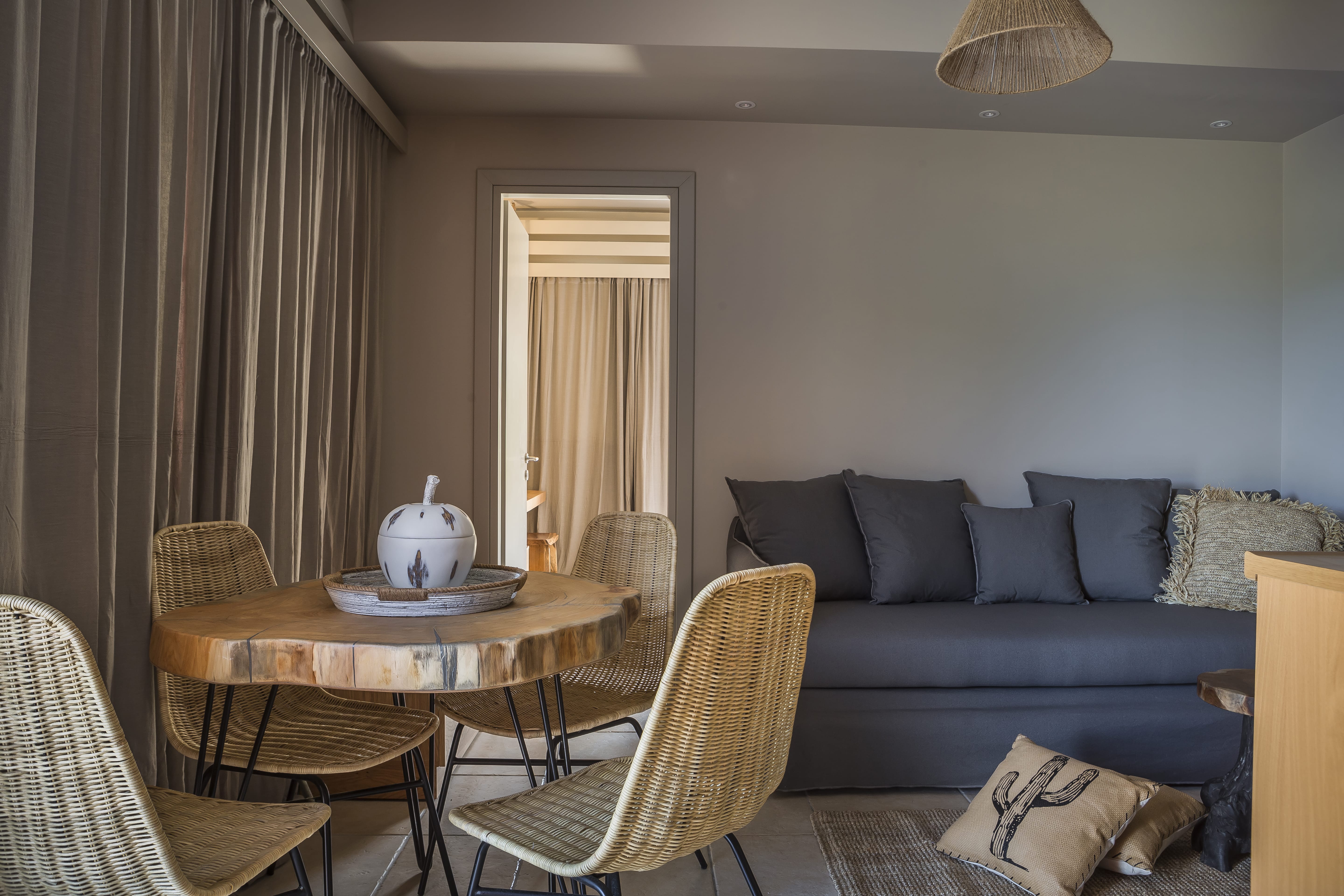 a living room with a blue couch and a table