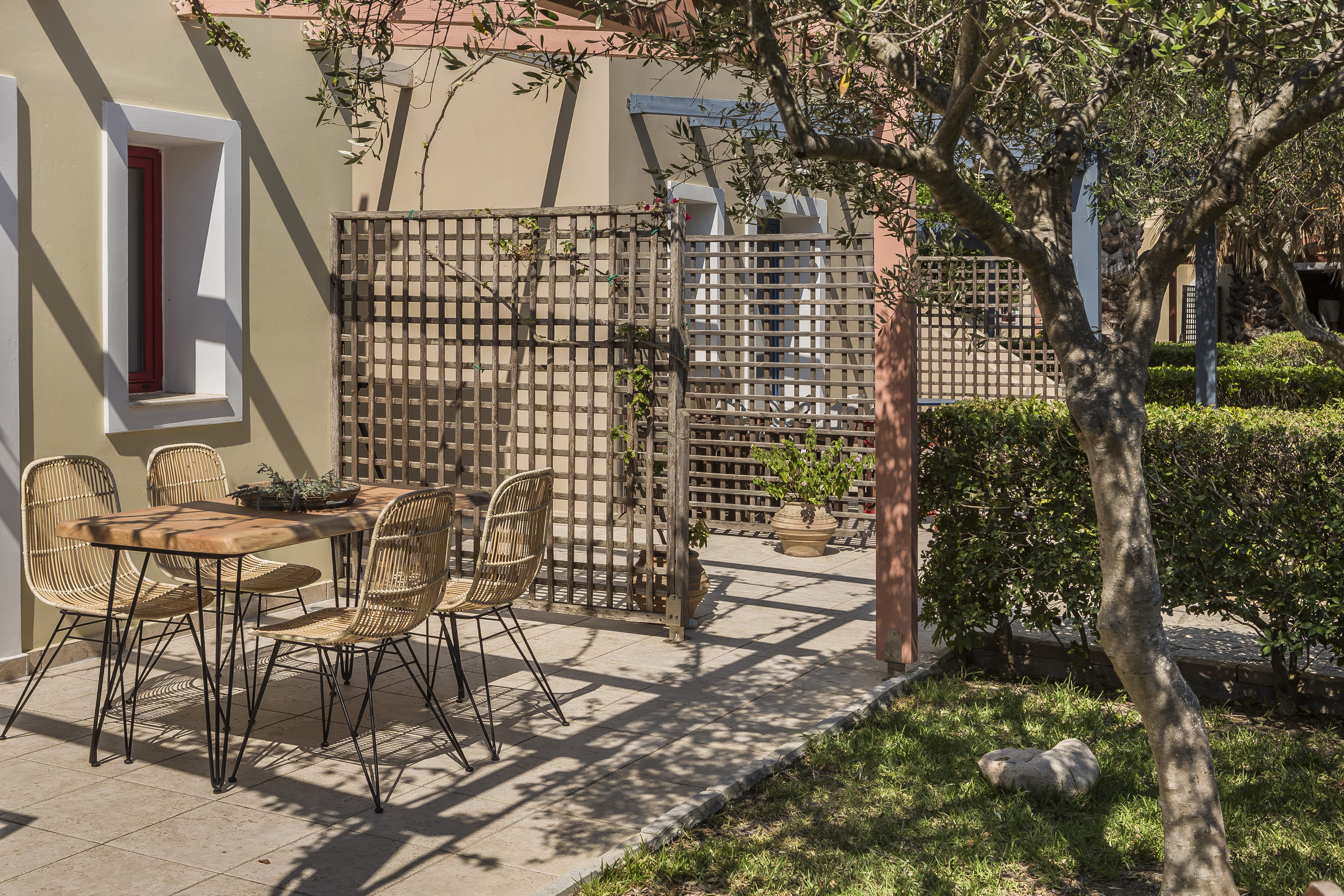 a patio with a table and chairs