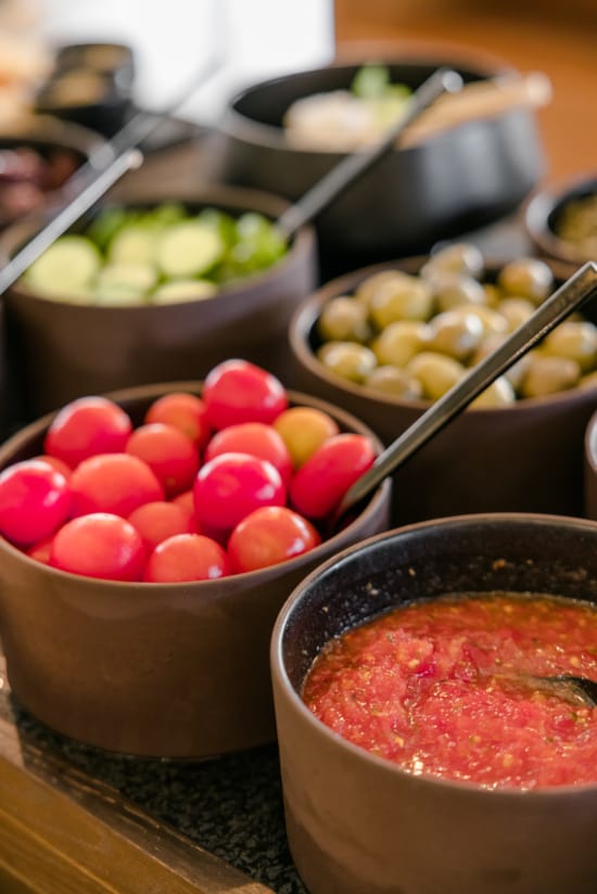 a group of bowls with food in it