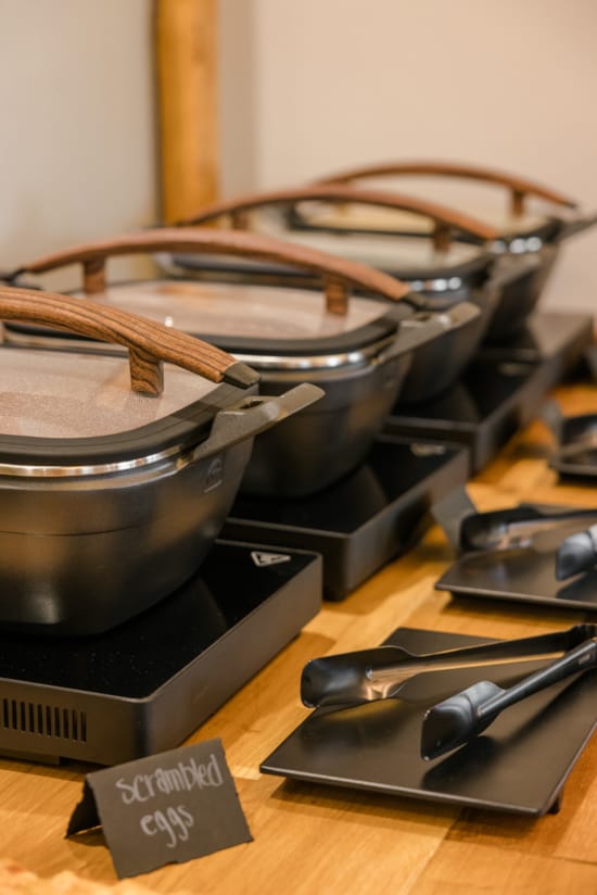 a group of metal pots on a table