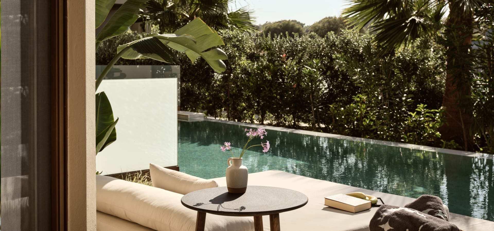 a pool with a table and chairs