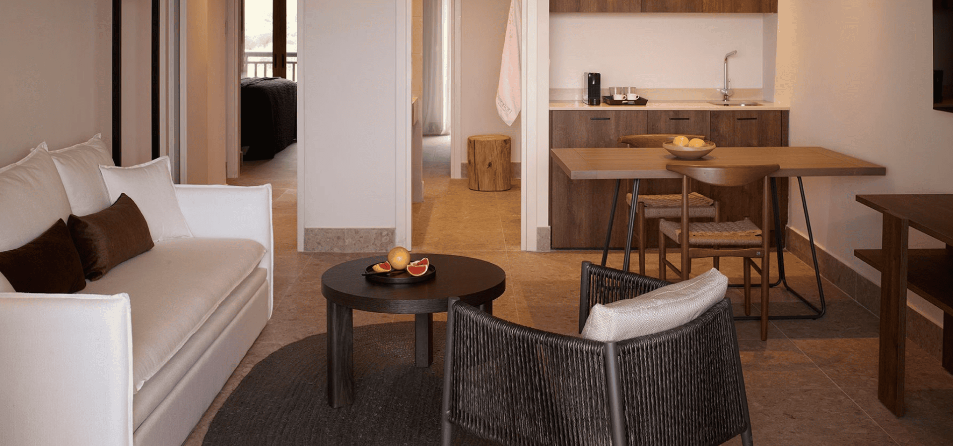 a living room with a couch and chairs