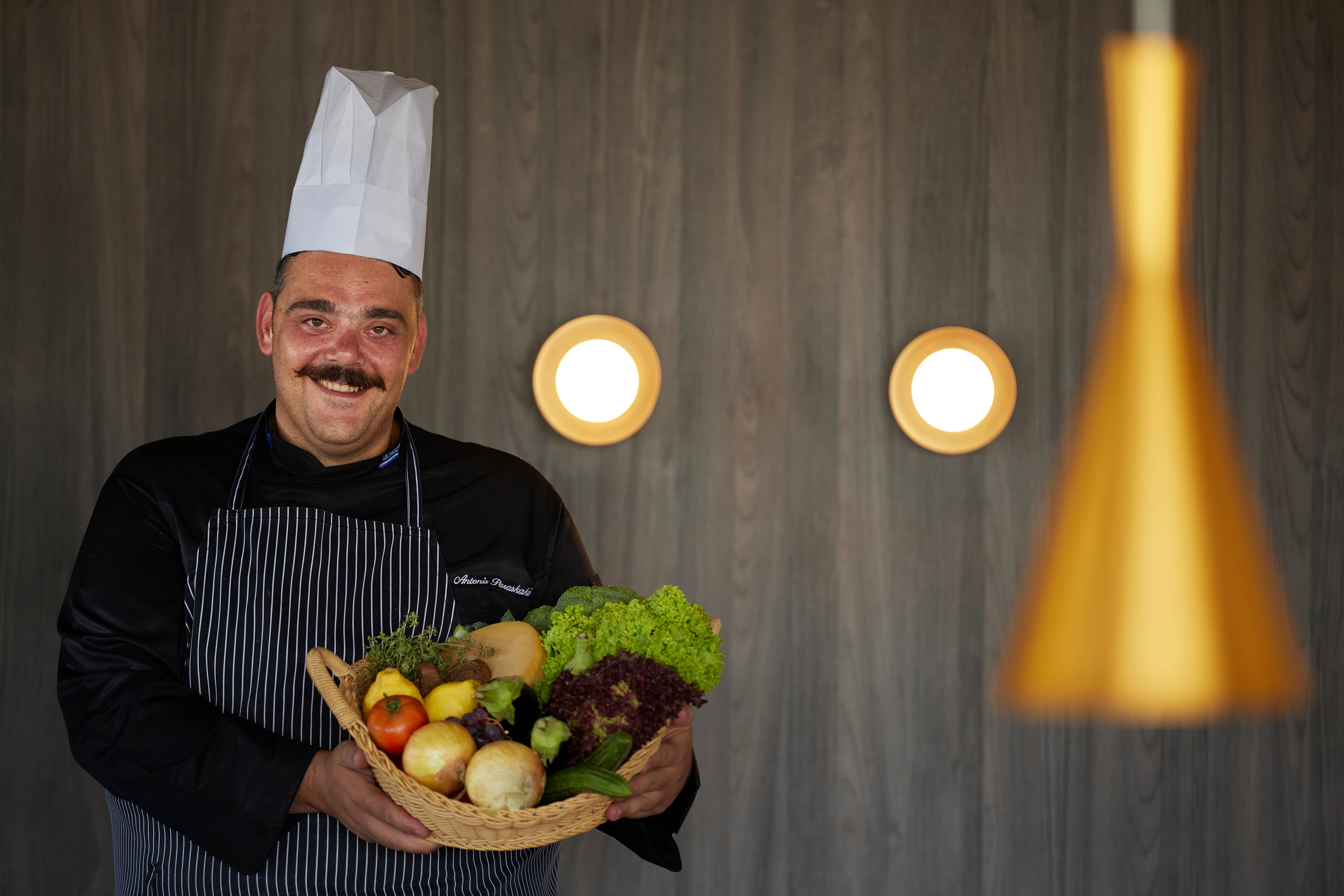 a man holding a basket of fruit