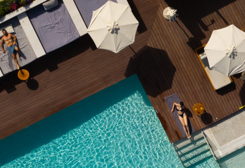 a pool with a person standing next to it