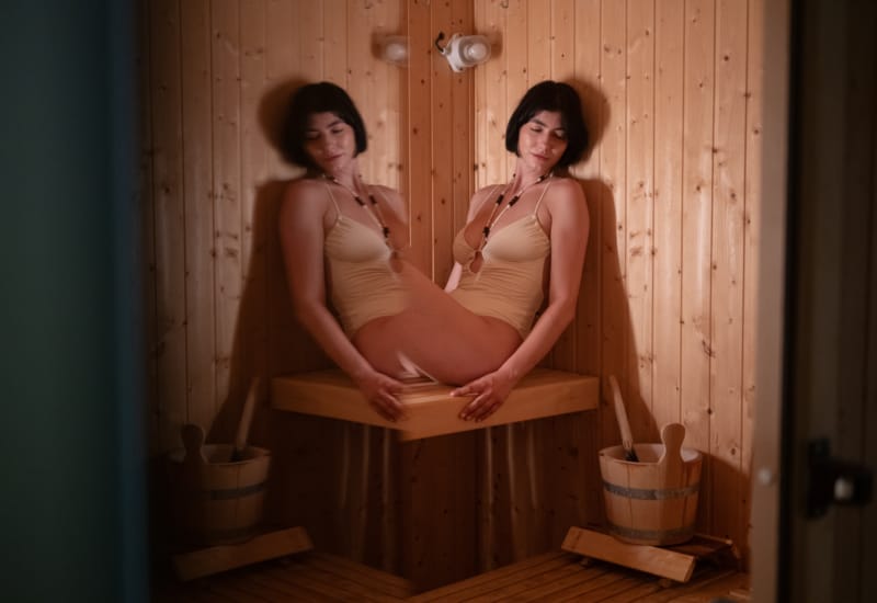 two women sitting on a bench