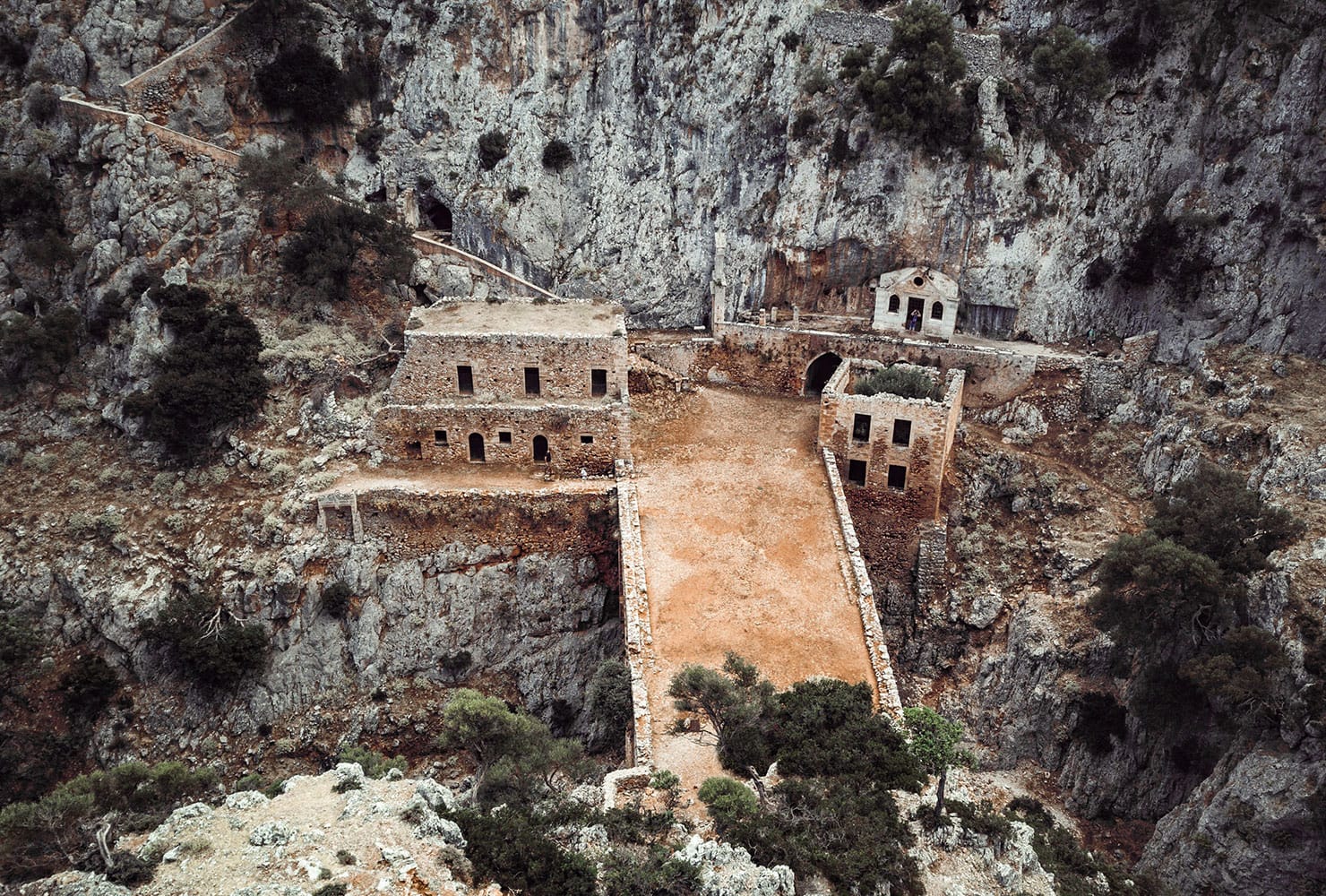 a group of buildings on a cliff