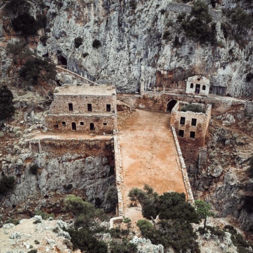 a group of buildings on a cliff