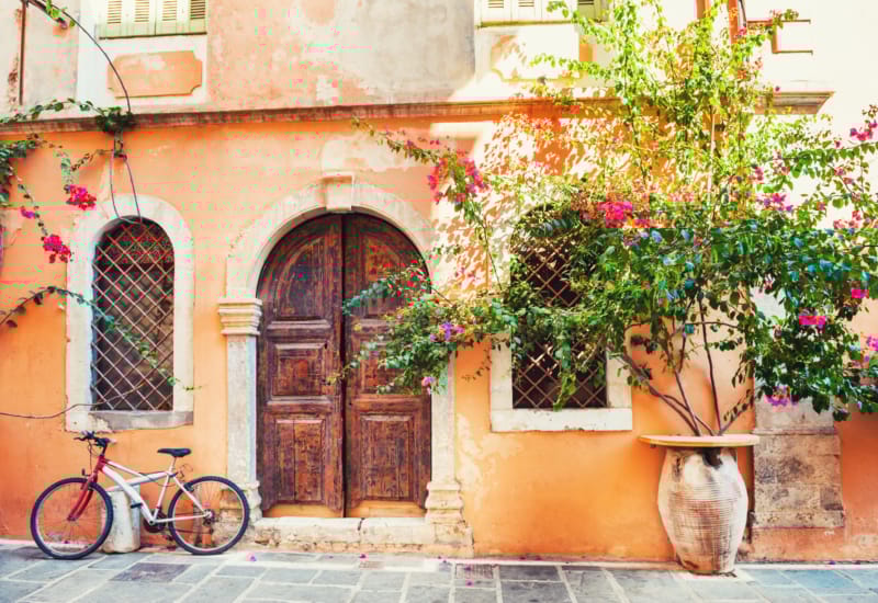 a bicycle parked next to a building