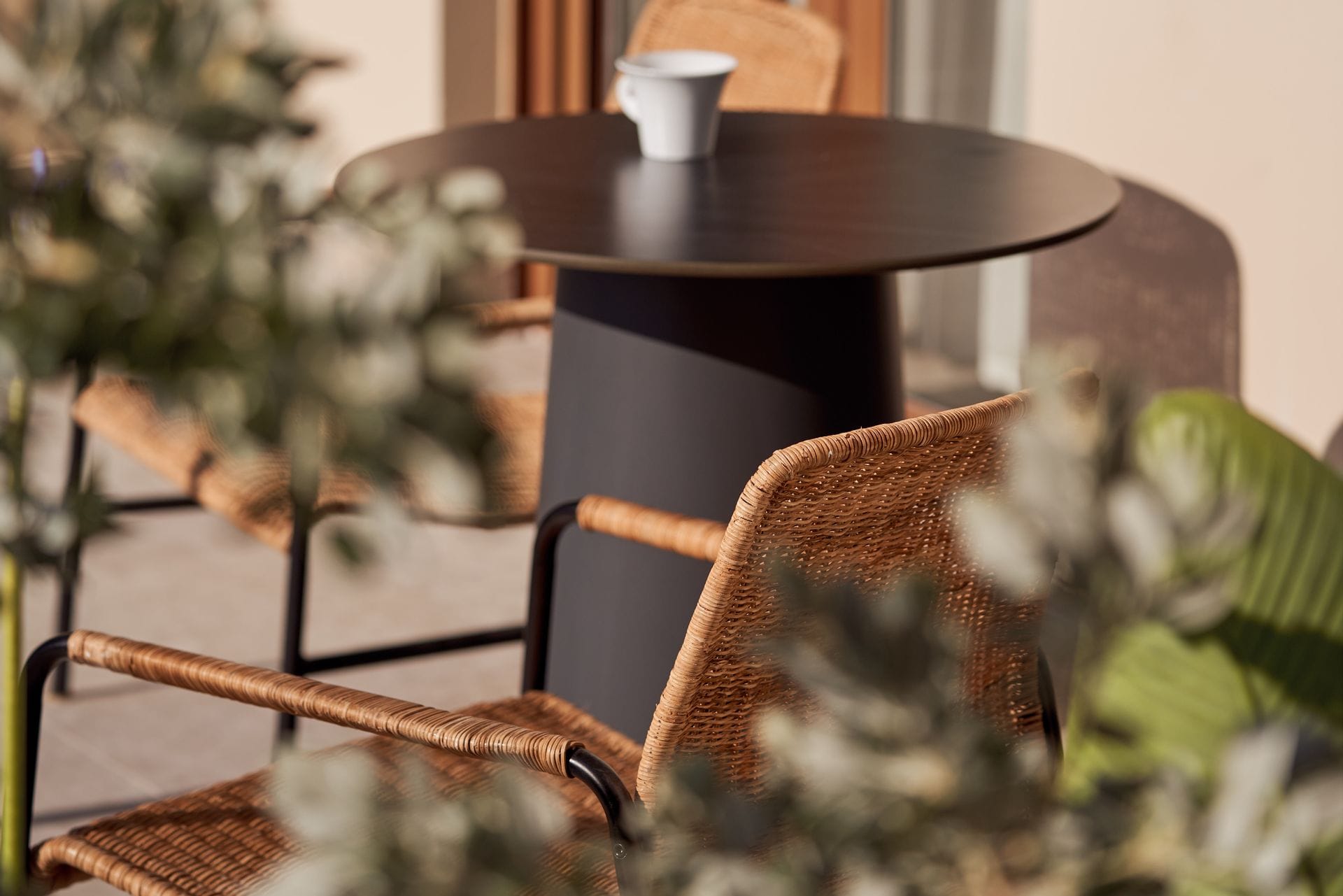 a table with a chair and flowers