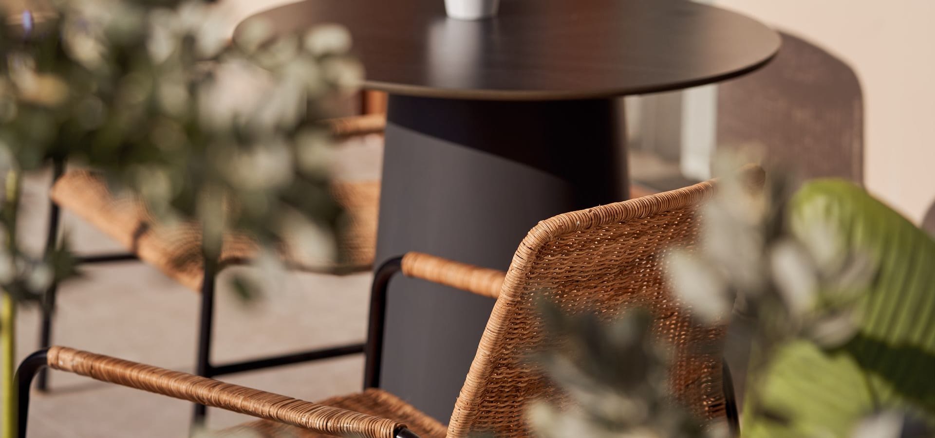 a table with a chair and flowers