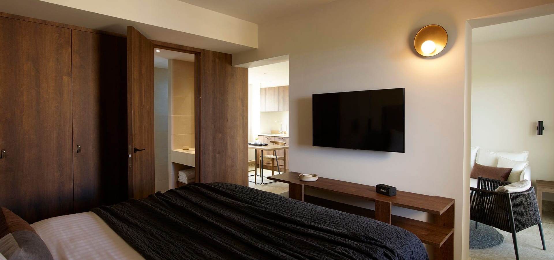 a hotel room with a tv and bed