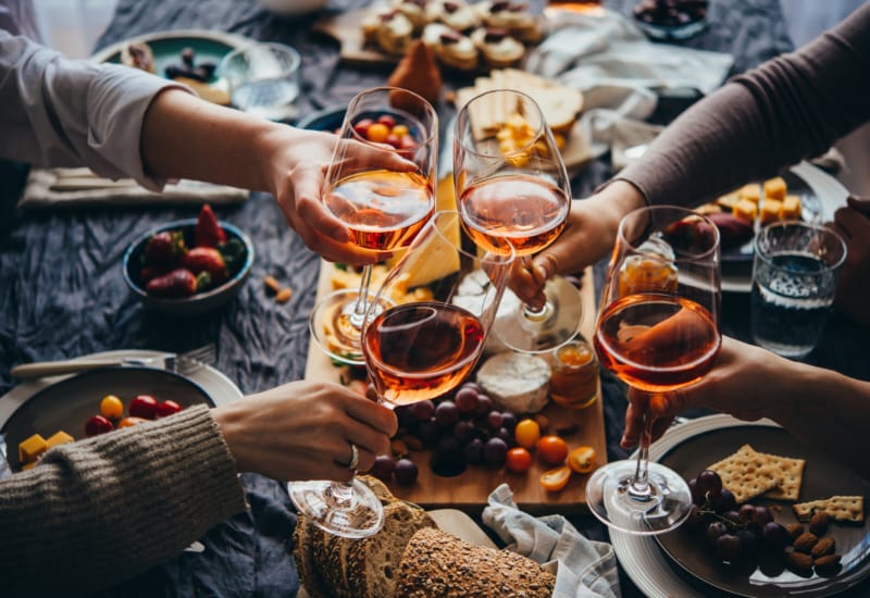 people holding glasses of wine