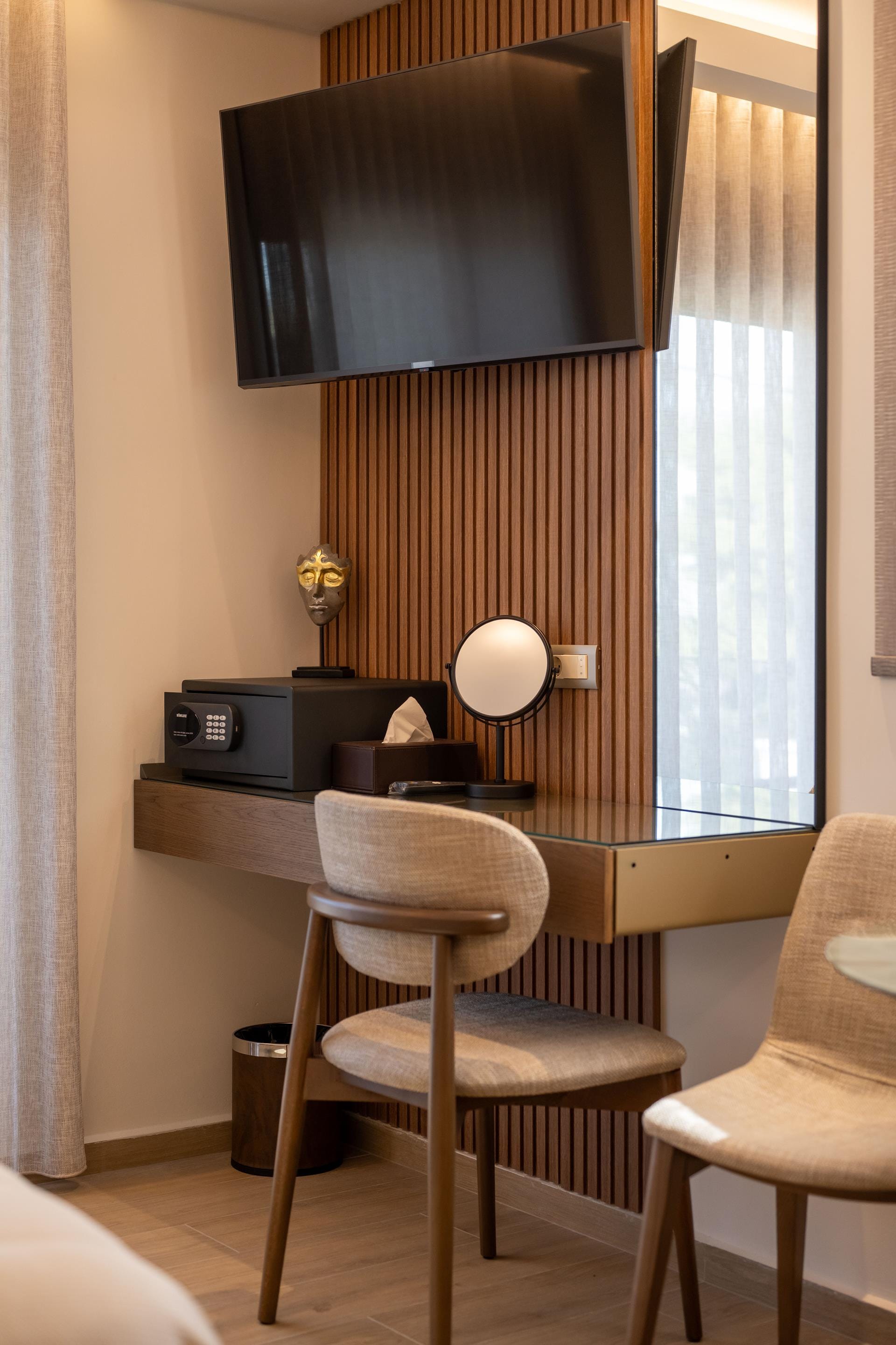 a room with a tv and chairs