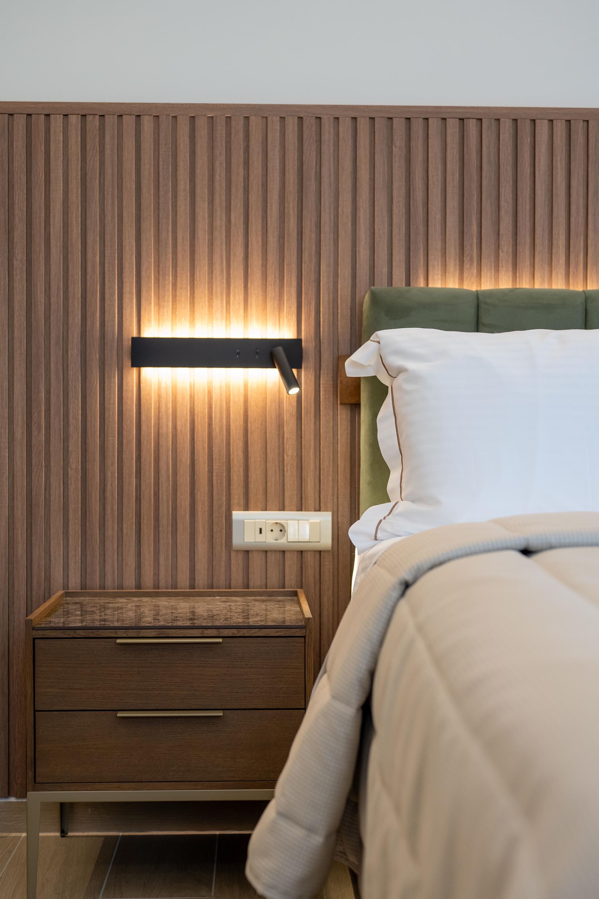 a bed with a lamp on it