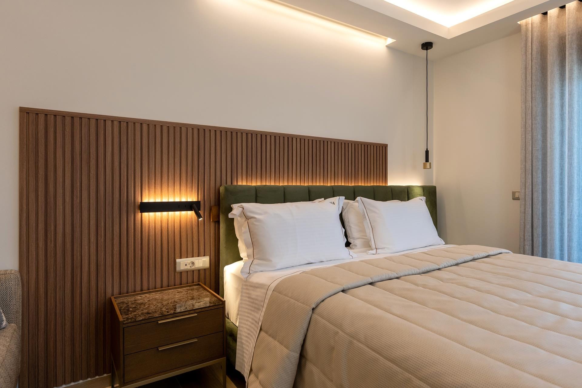 a bed with a white bed spread