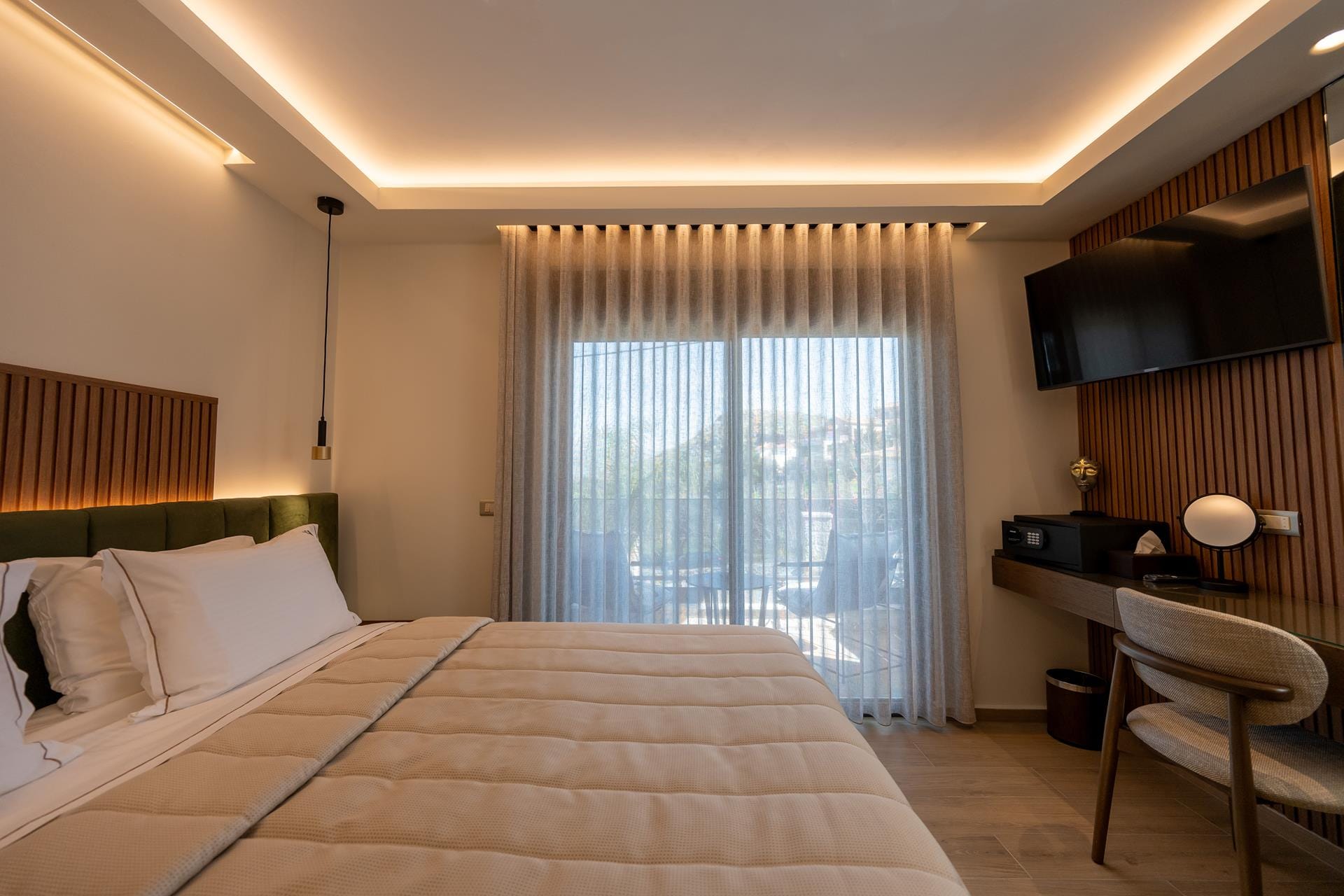 a hotel room with a bed and a tv