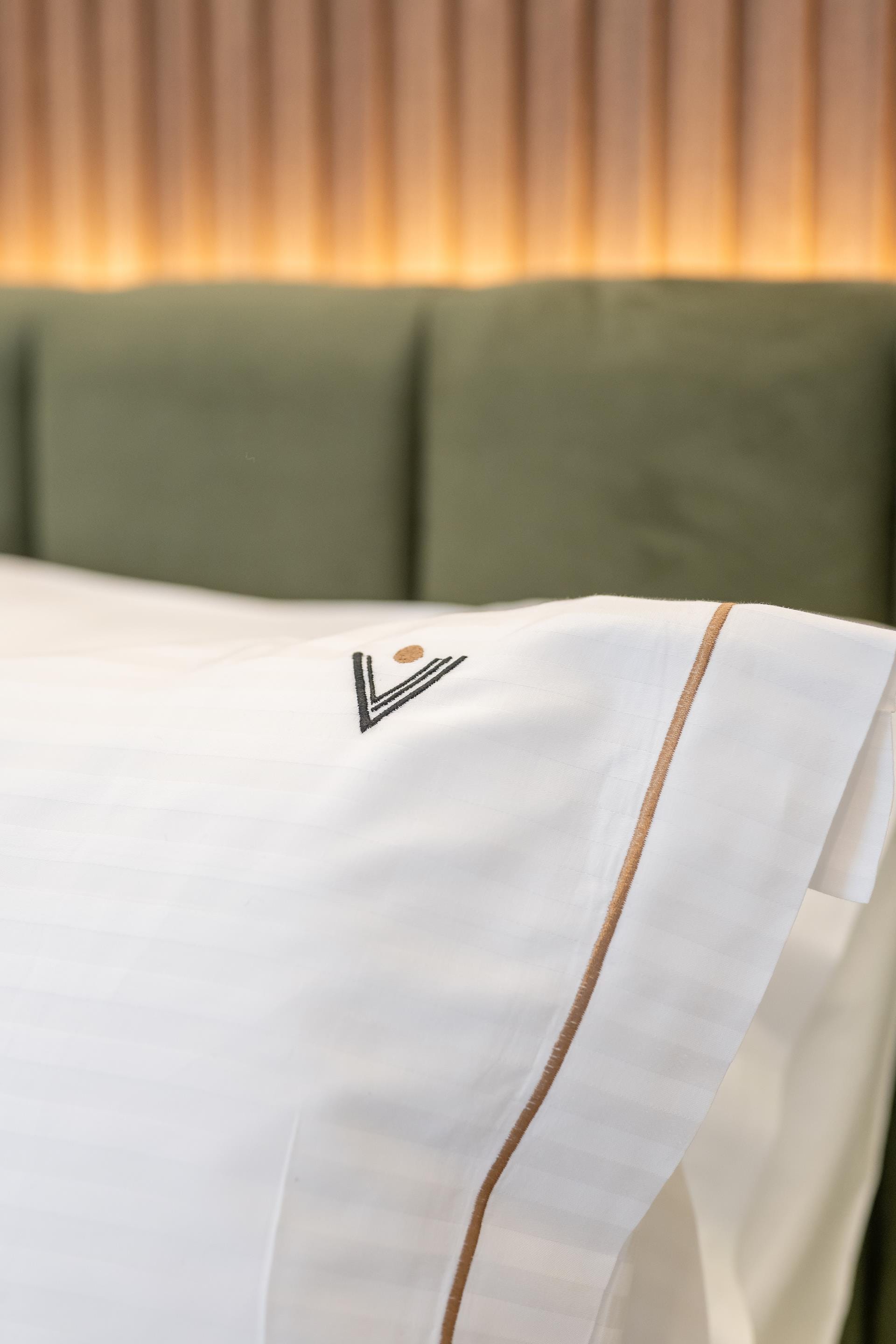 a white pillow with a logo on it