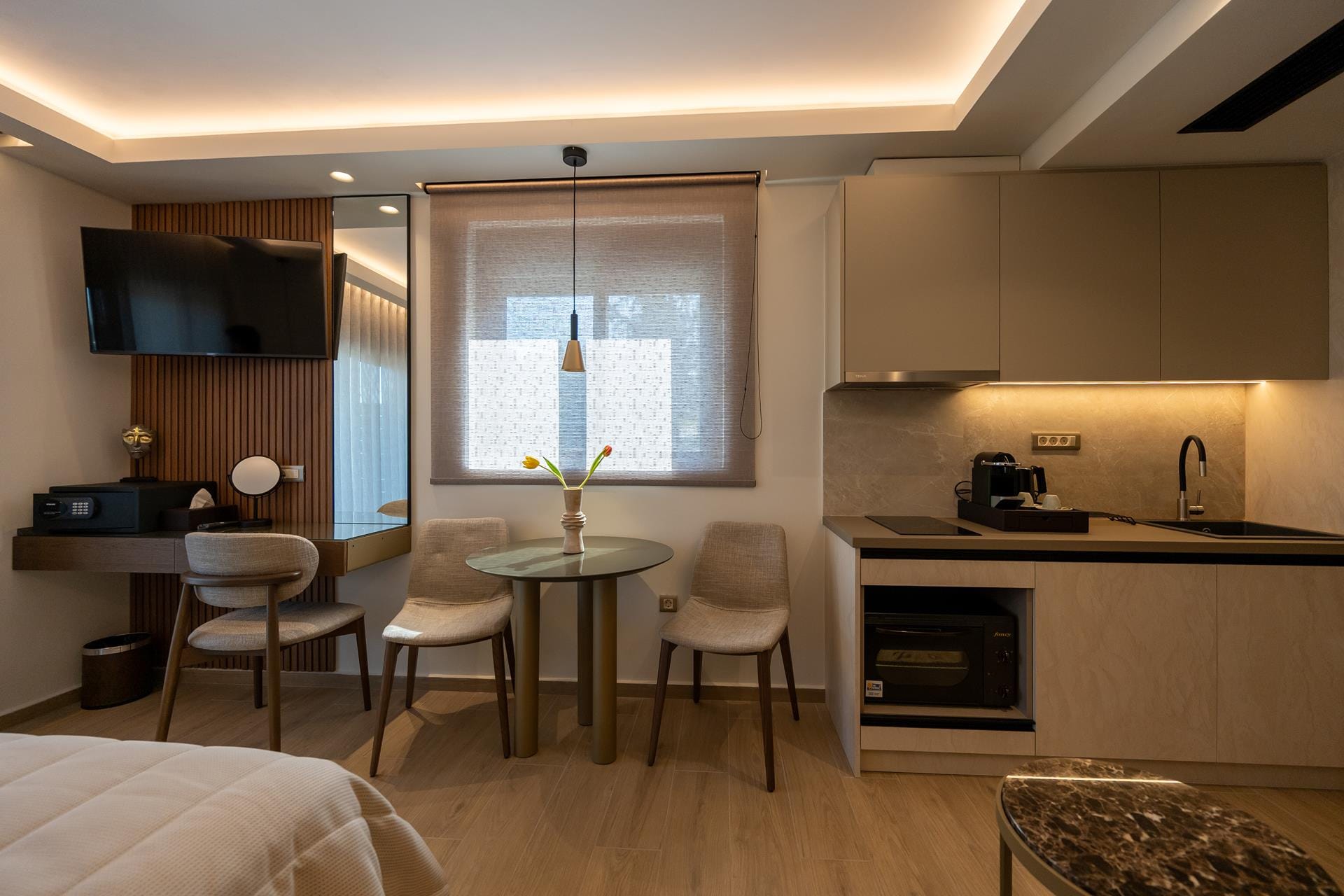 a kitchen with a table and chairs