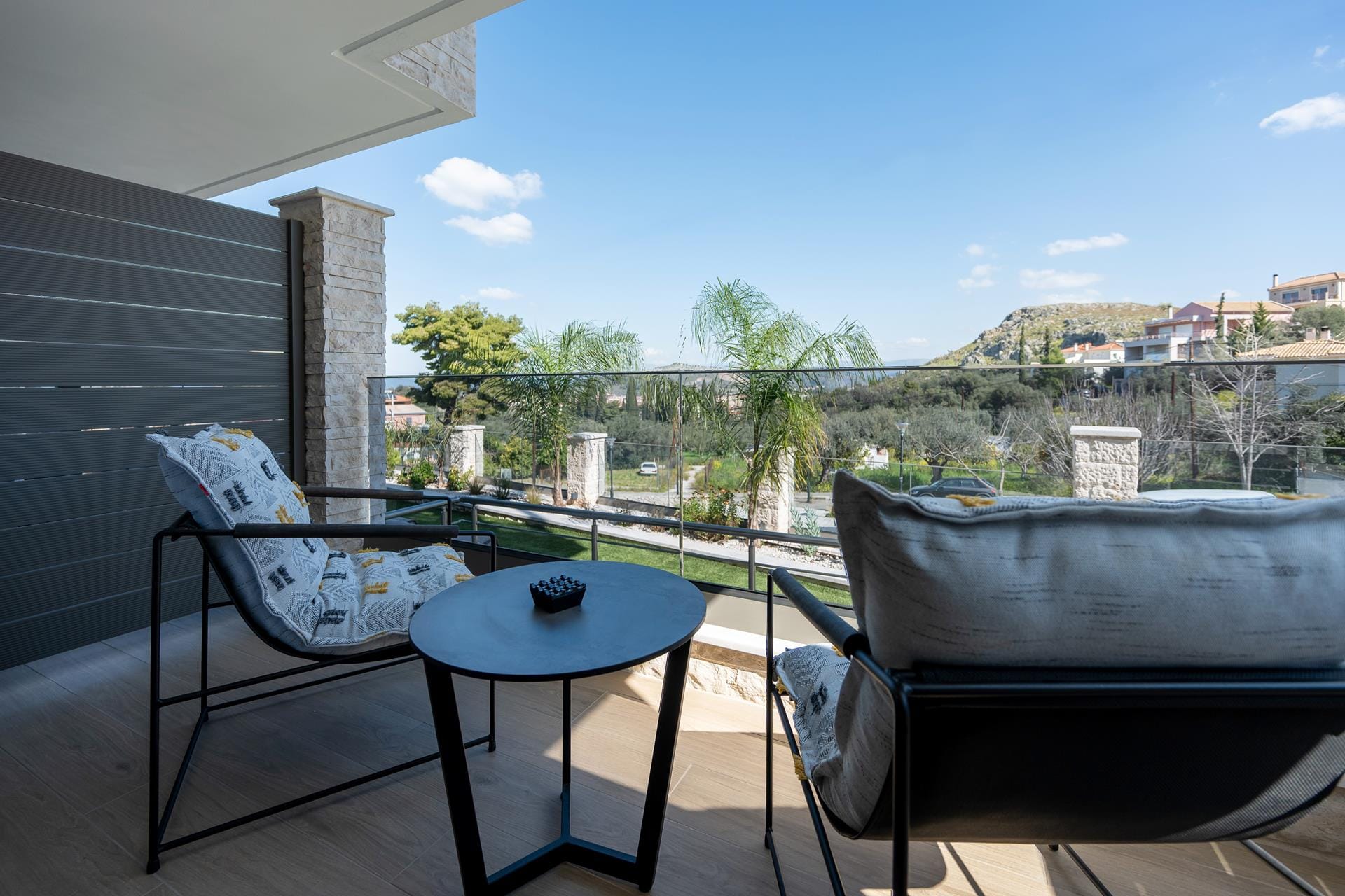 a table and chairs on a balcony