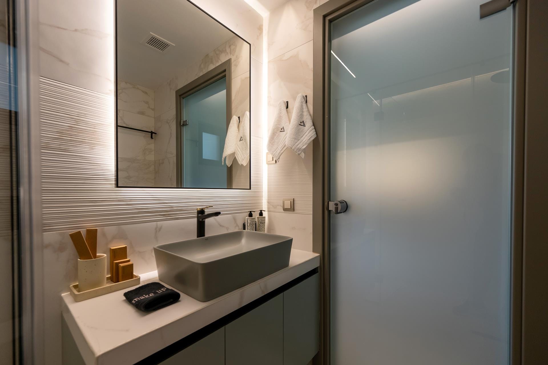 a bathroom with a mirror and sink