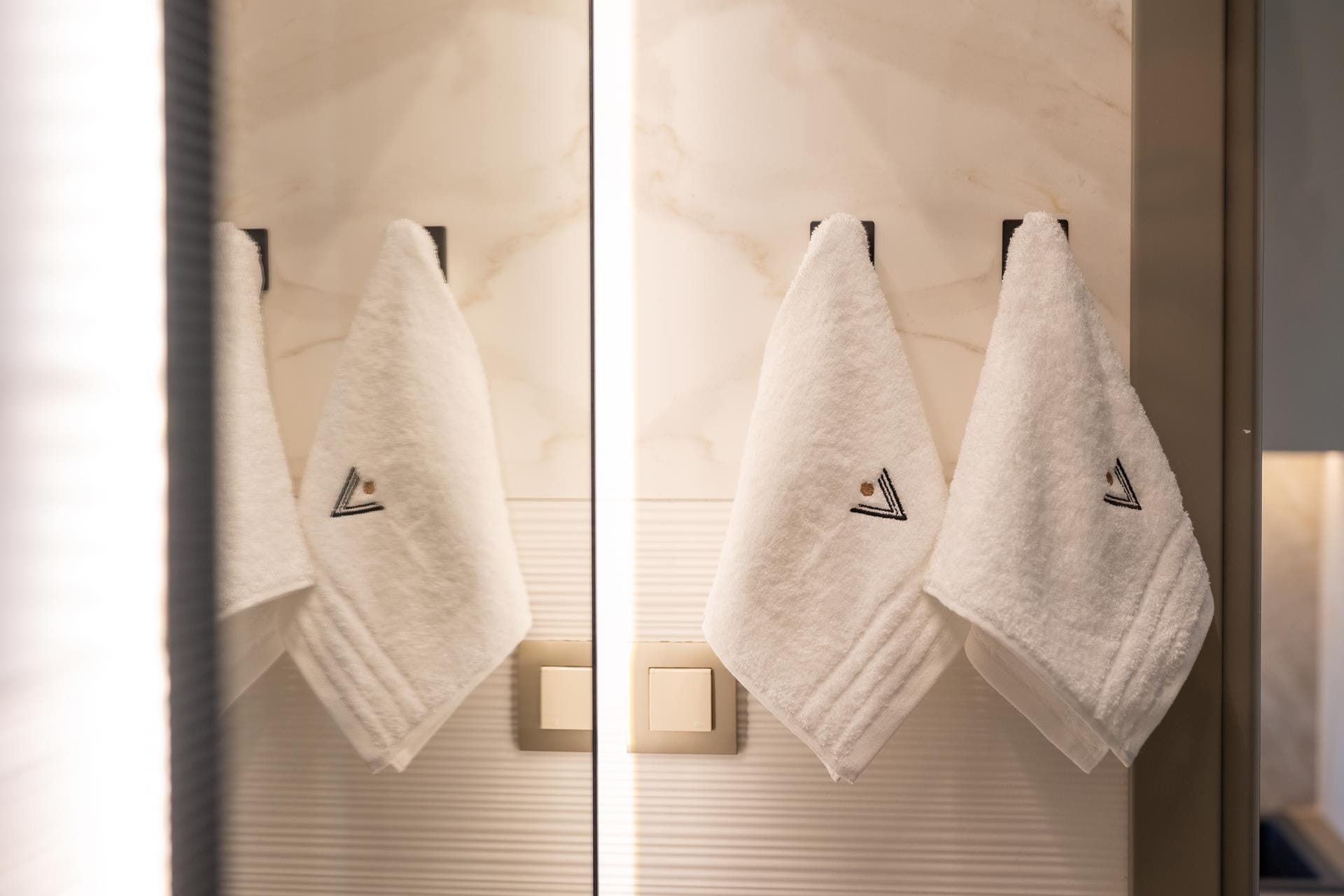 a group of white dresses on a wall