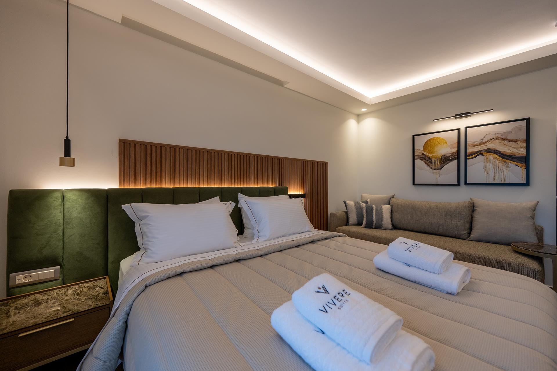 a hotel room with a bed and a towel on the bed