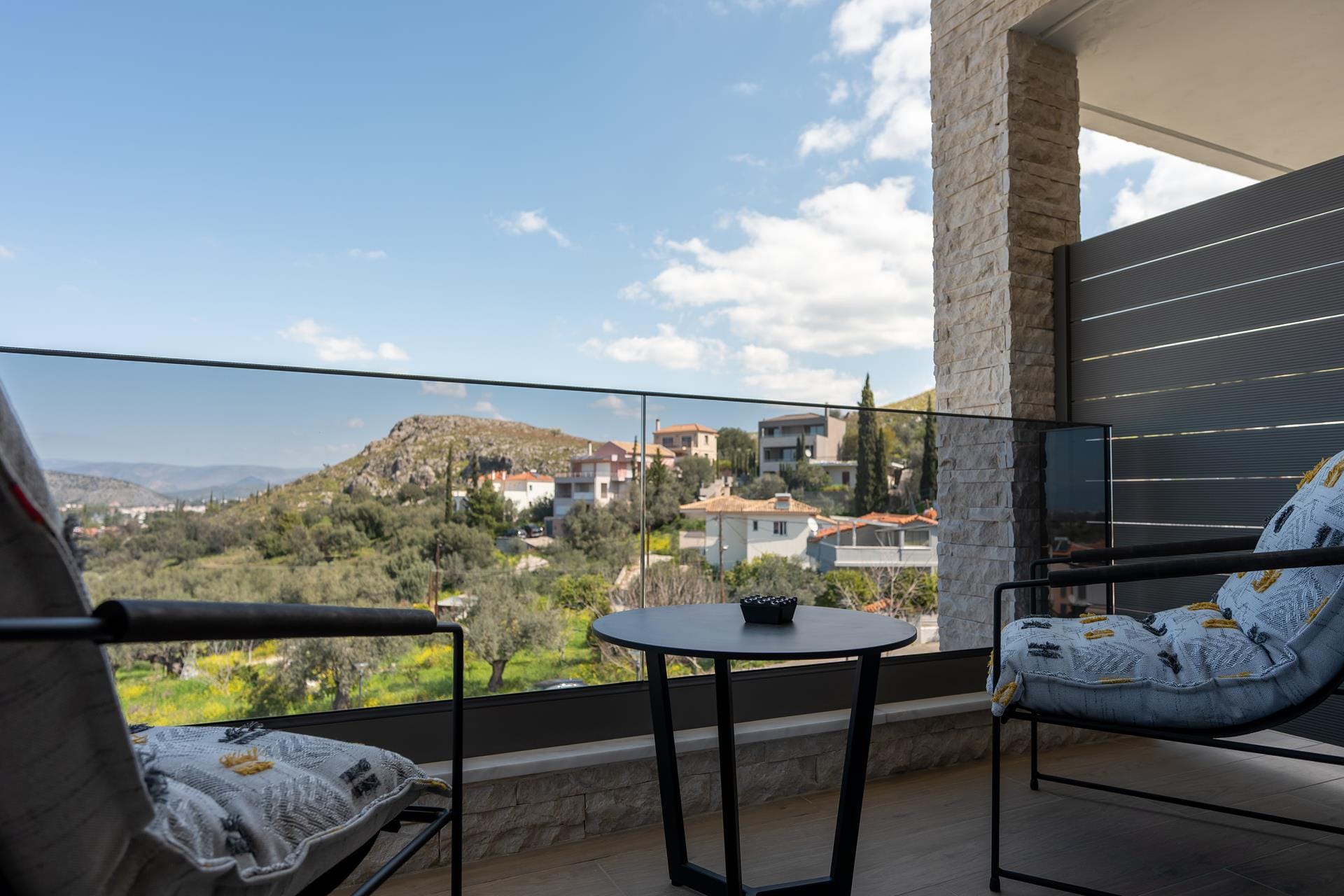 a table and chairs on a balcony