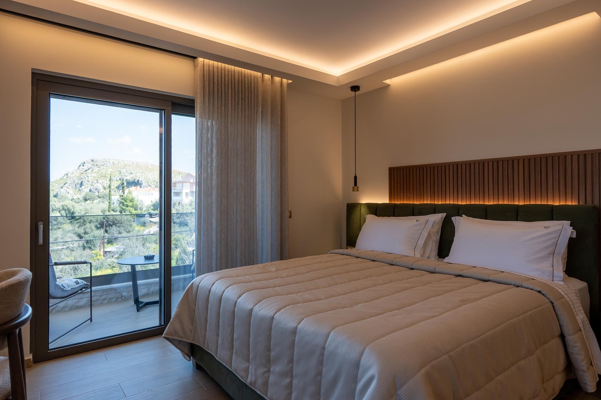 a bedroom with a large window