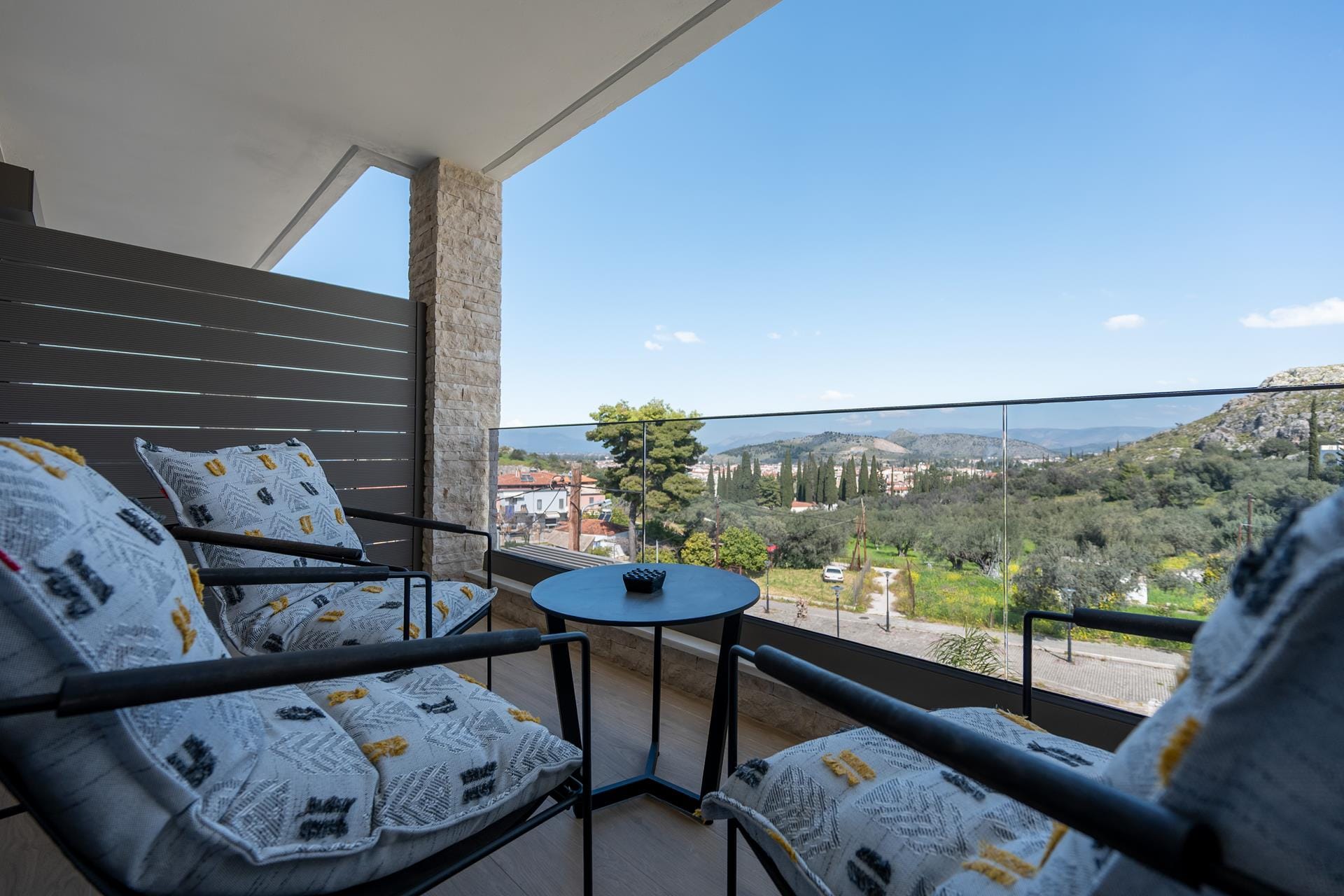 a table and chairs on a balcony