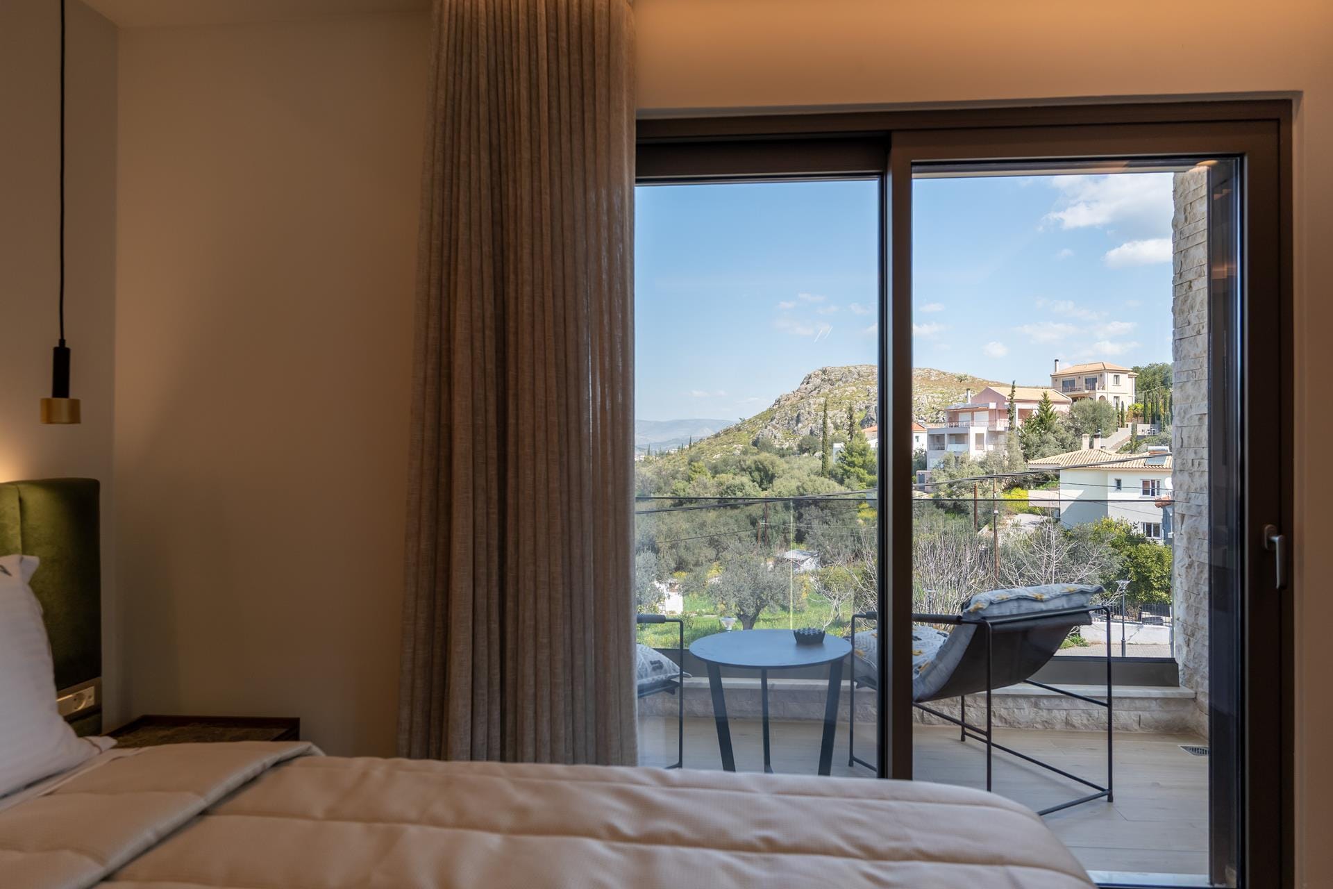 a bedroom with a large window